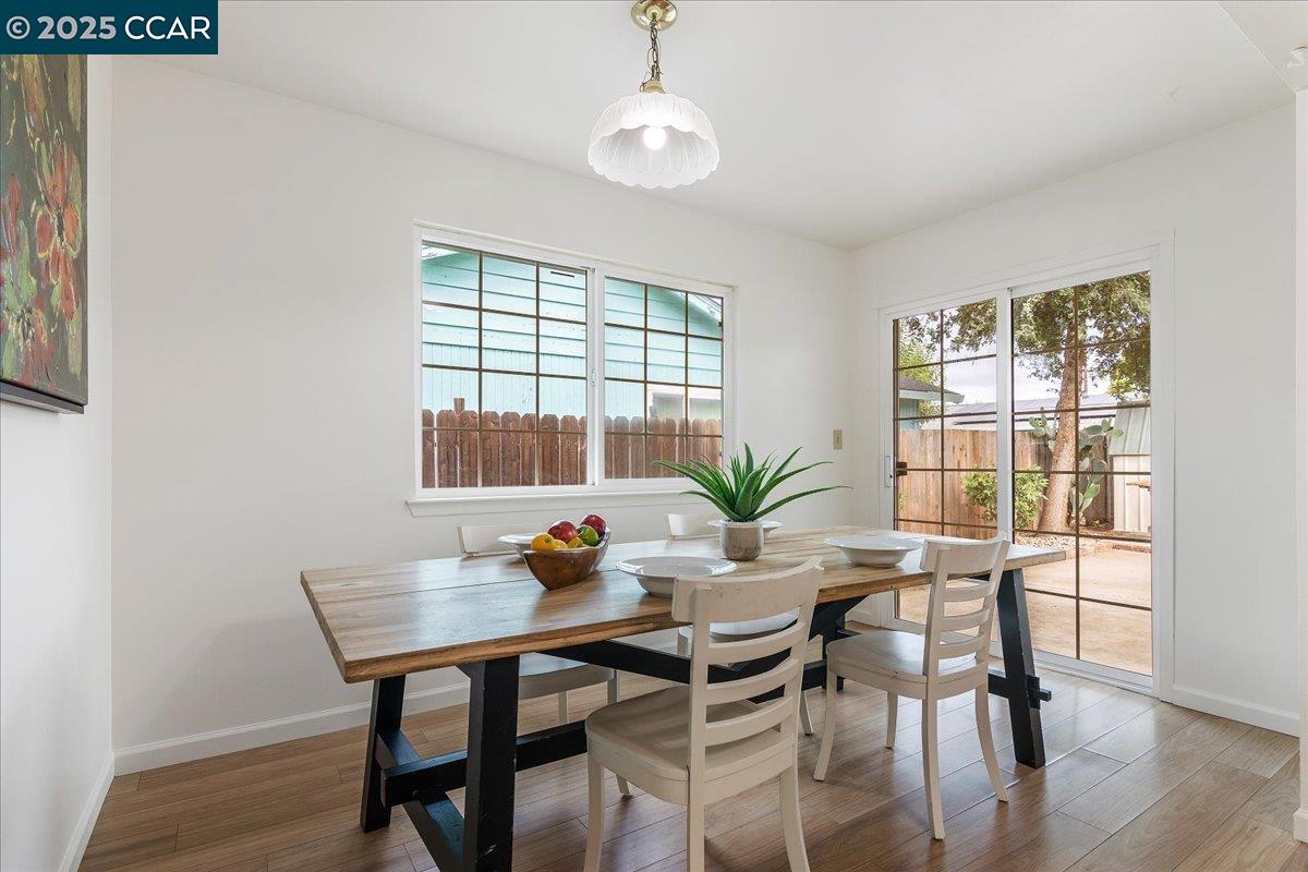 4081 Salem Street Concord, CA 94521 - Photo 10 of 27 a dining room with furniture and wooden floor