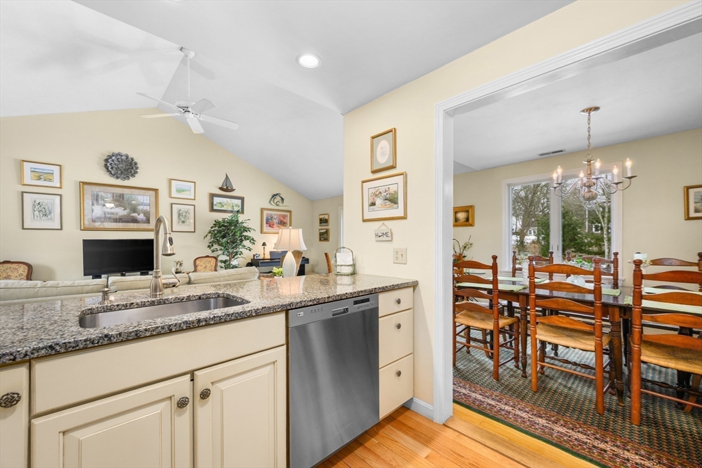 1 Seastrand Way, Unit 1 Chatham, MA 02633 - Photo 15 of 35 a kitchen with stainless steel appliances granite countertop a sink and cabinets