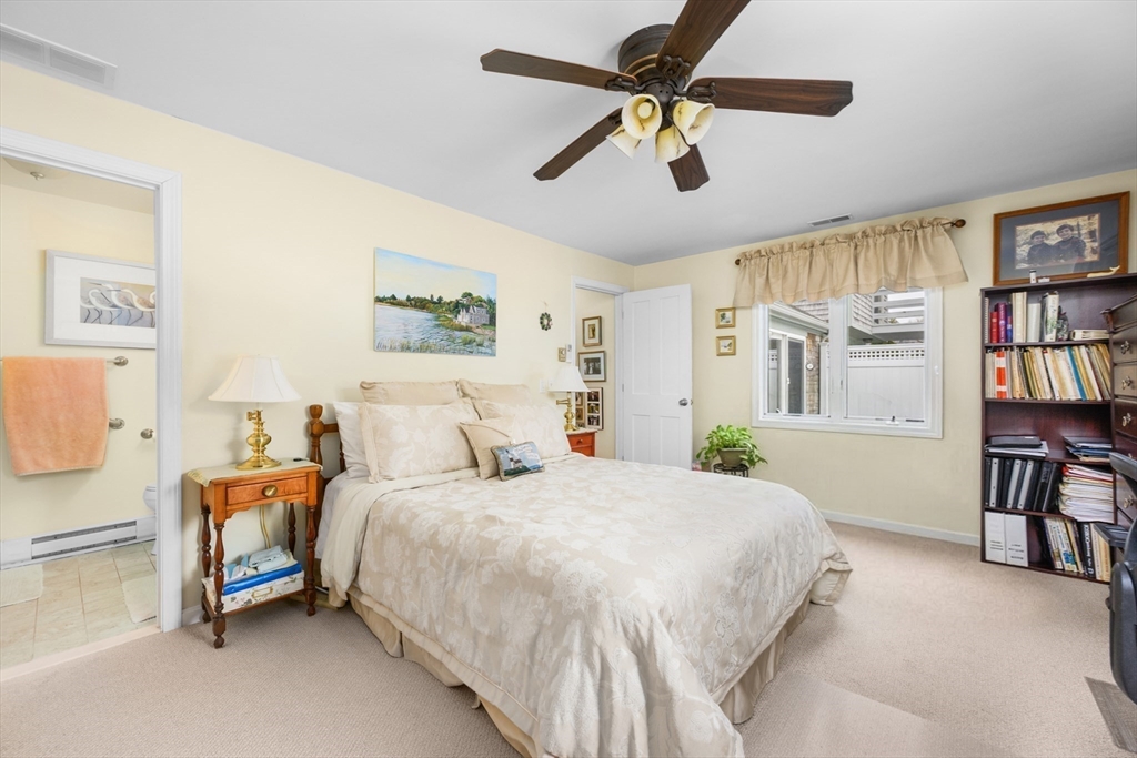 1 Seastrand Way, Unit 1 Chatham, MA 02633 - Photo 19 of 35 a bedroom with a bed a dresser and a book shelf