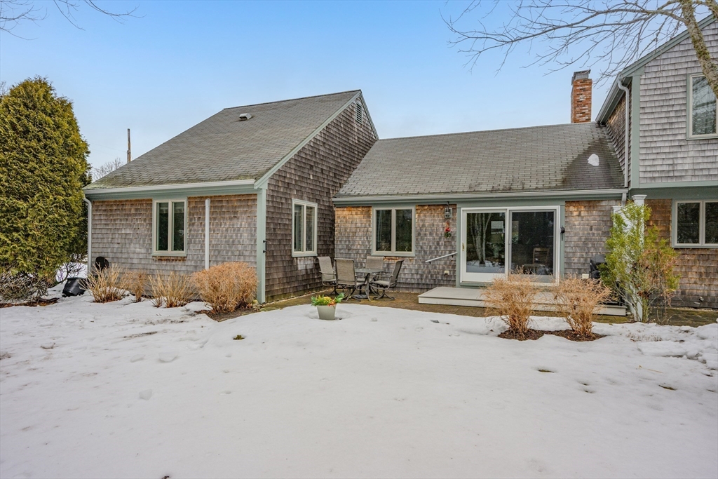 1 Seastrand Way, Unit 1 Chatham, MA 02633 - Photo 31 of 35 a front view of house with yard outdoor seating and barbeque oven