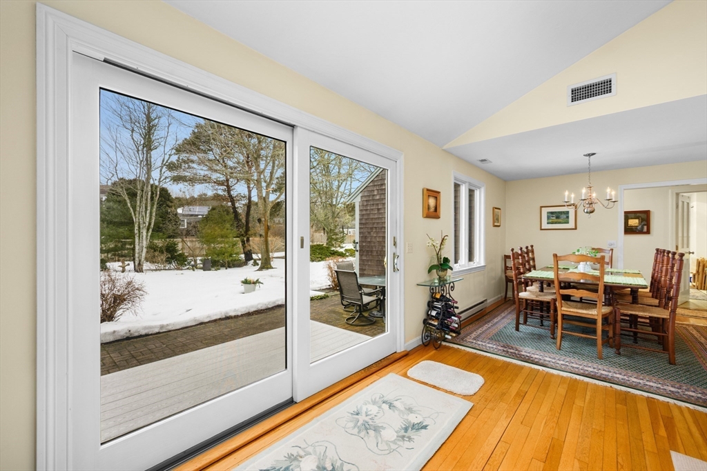 1 Seastrand Way, Unit 1 Chatham, MA 02633 - Photo 10 of 35 a living room with furniture and a table
