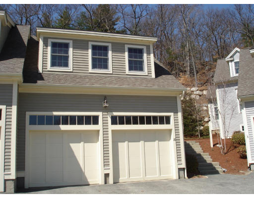 10 Chestnut Lane, Unit 12 Lexington, MA 02421 - Photo 1 of 11 a front view of a house with a tree