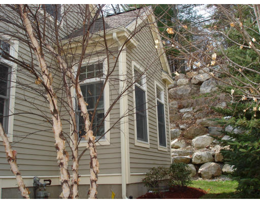 10 Chestnut Lane, Unit 12 Lexington, MA 02421 - Photo 3 of 11 a view of a house with a tree