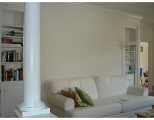10 Chestnut Lane, Unit 12 Lexington, MA 02421 - Photo 8 of 11 a living room with furniture and a book shelf