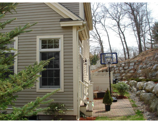 10 Chestnut Lane, Unit 12 Lexington, MA 02421 - Photo 10 of 11 front view of a house with a yard