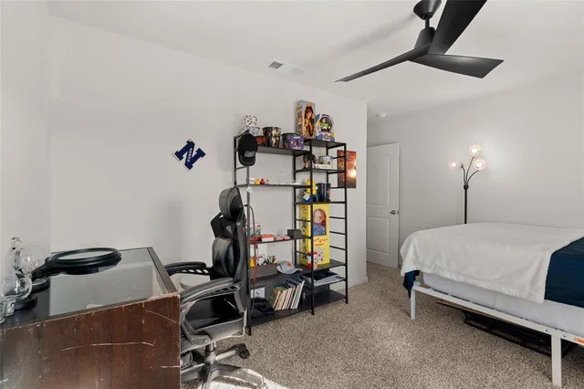 a bedroom with a bed and a table