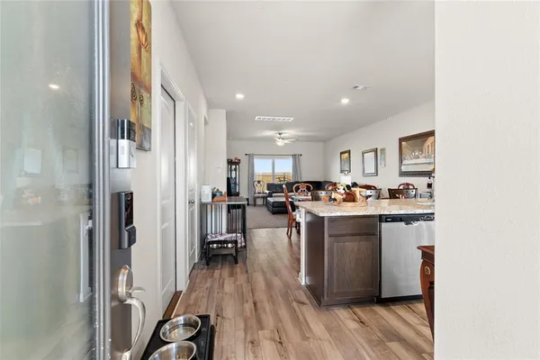 a kitchen with stainless steel appliances granite countertop a stove and a refrigerator