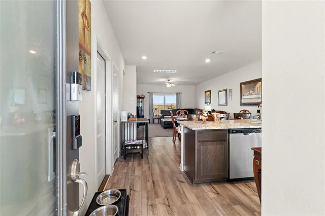 a kitchen with stainless steel appliances granite countertop a stove and a refrigerator