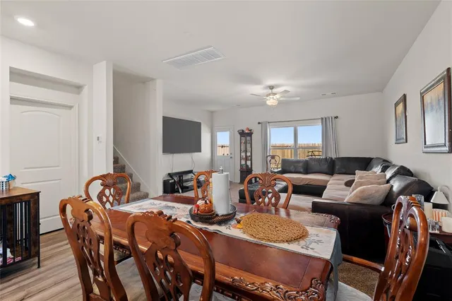 a view of a dining room with furniture and a livingroom
