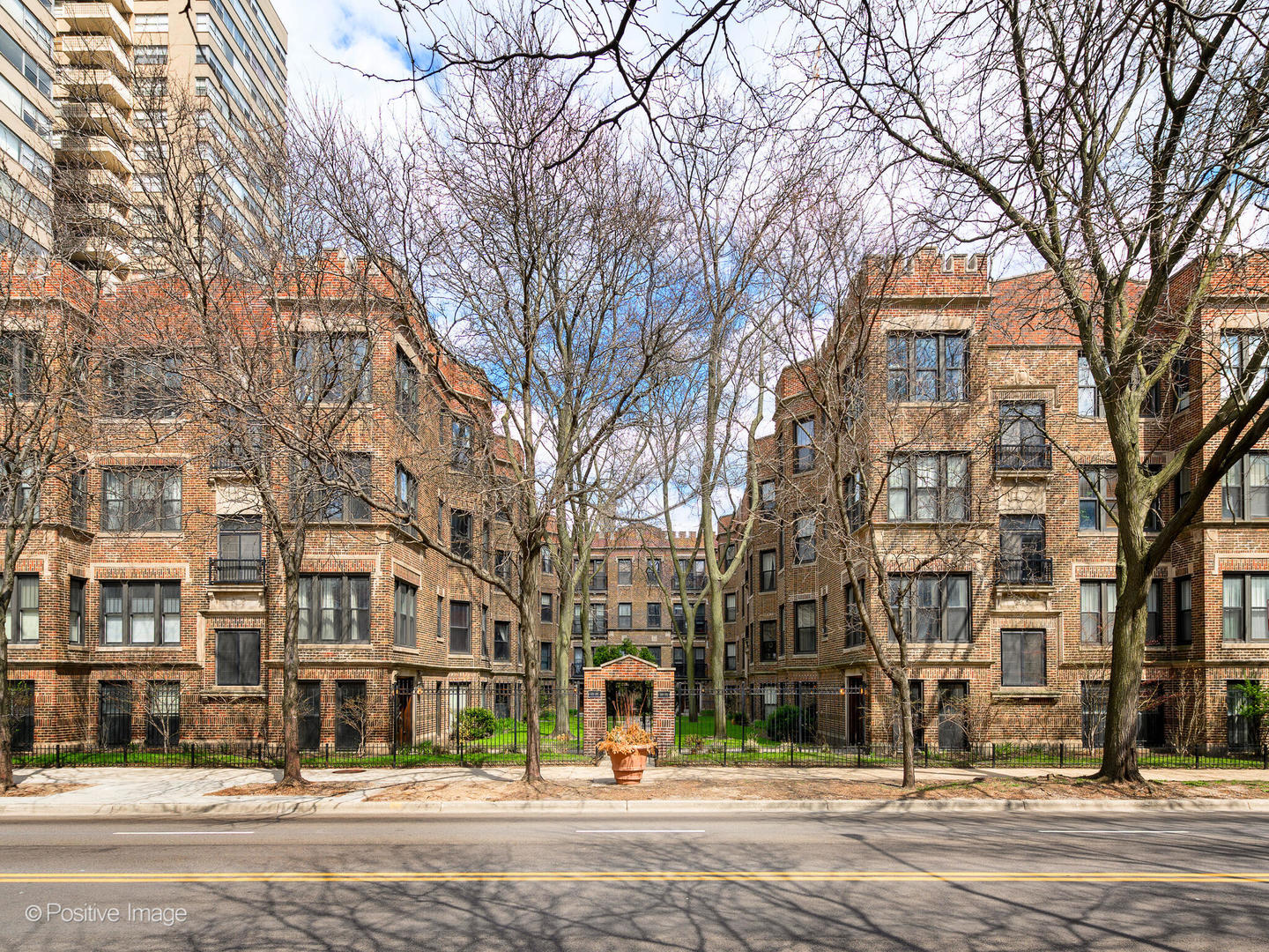 6259 North Sheridan Road, Unit 50 Chicago, IL 60660 - Photo 1 of 18 front view of a building with large trees