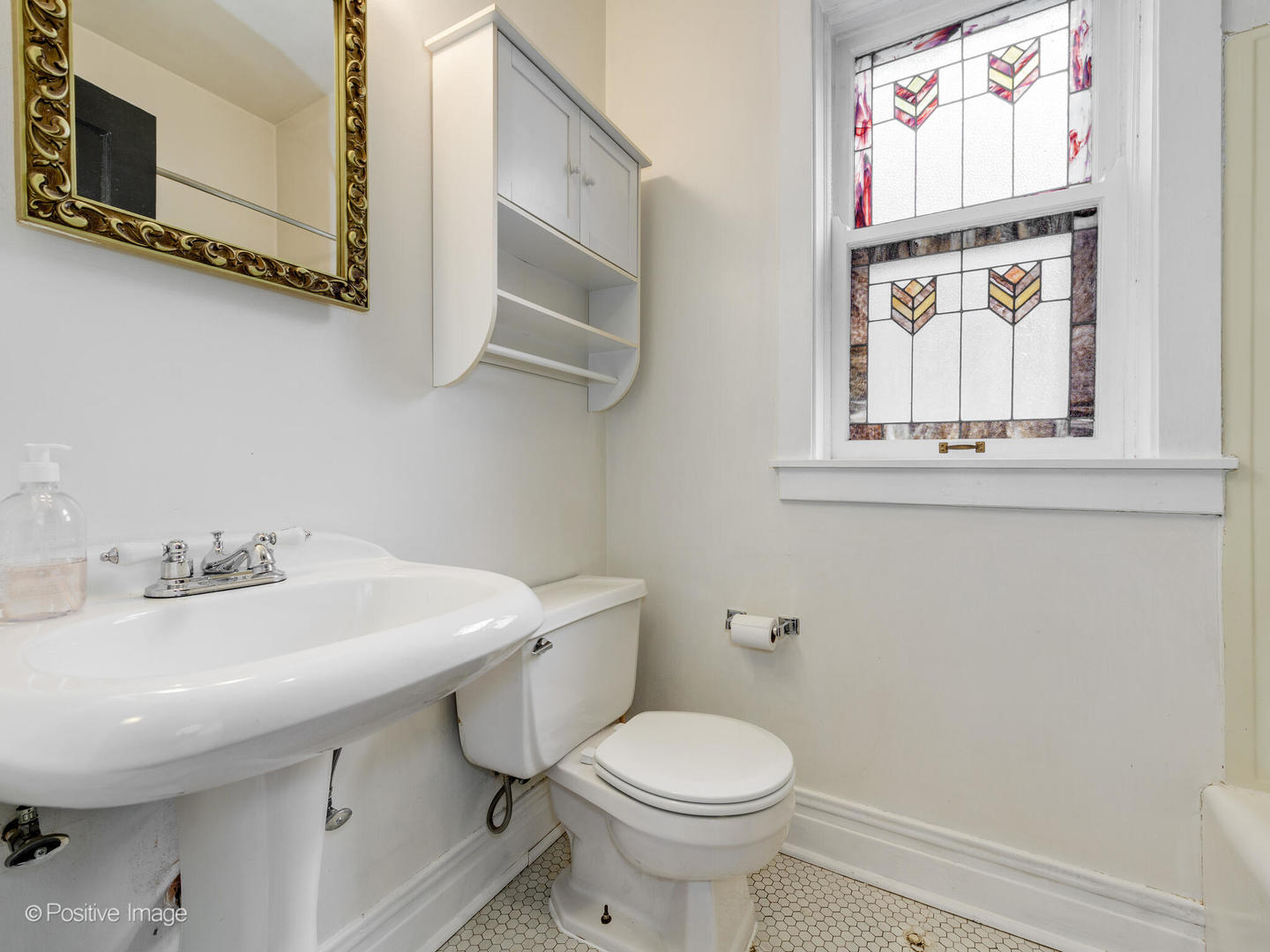 6259 North Sheridan Road, Unit 50 Chicago, IL 60660 - Photo 12 of 18 a bathroom with a sink a toilet and a mirror