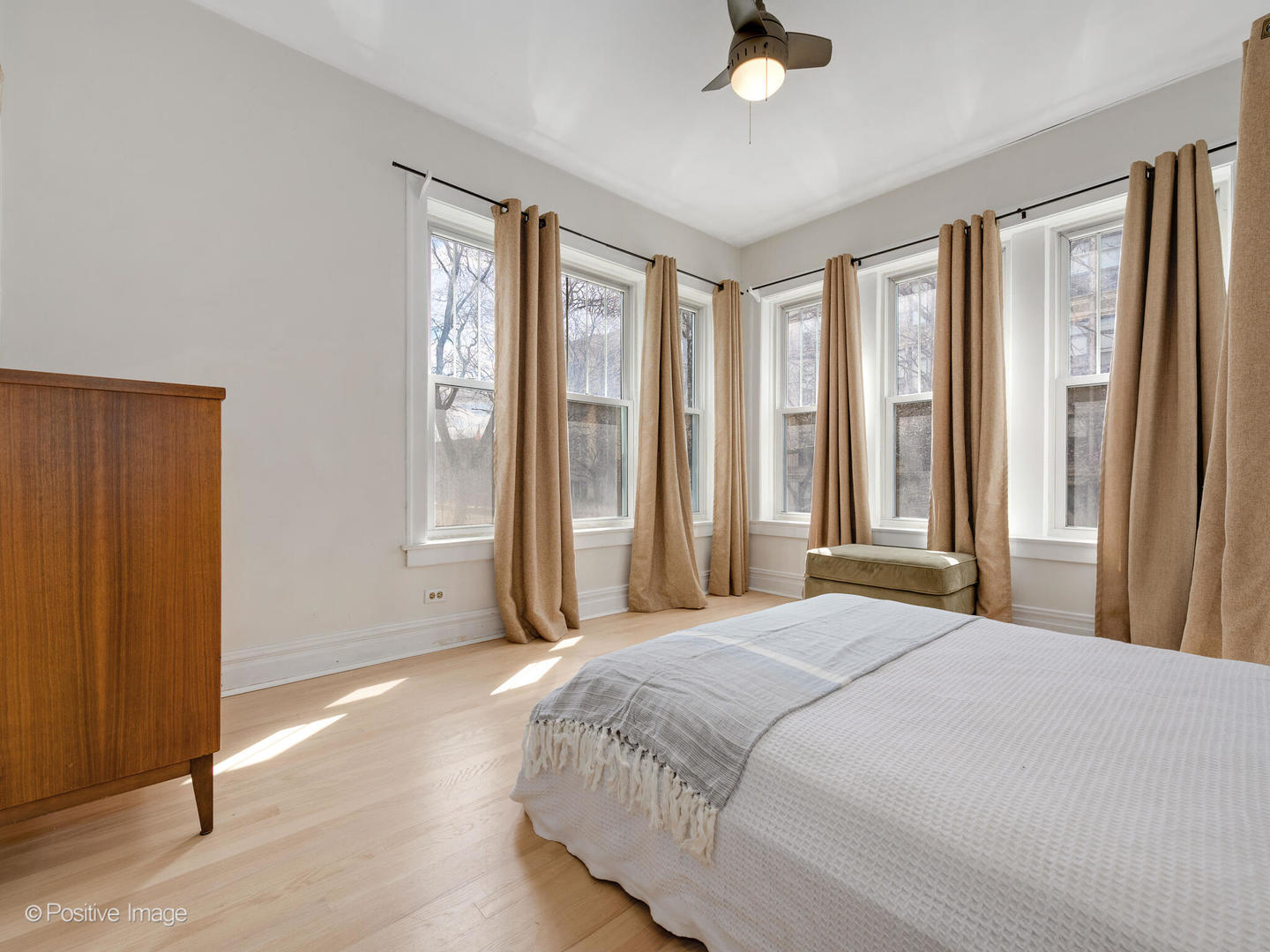 6259 North Sheridan Road, Unit 50 Chicago, IL 60660 - Photo 14 of 18 a bedroom with a bed and large windows