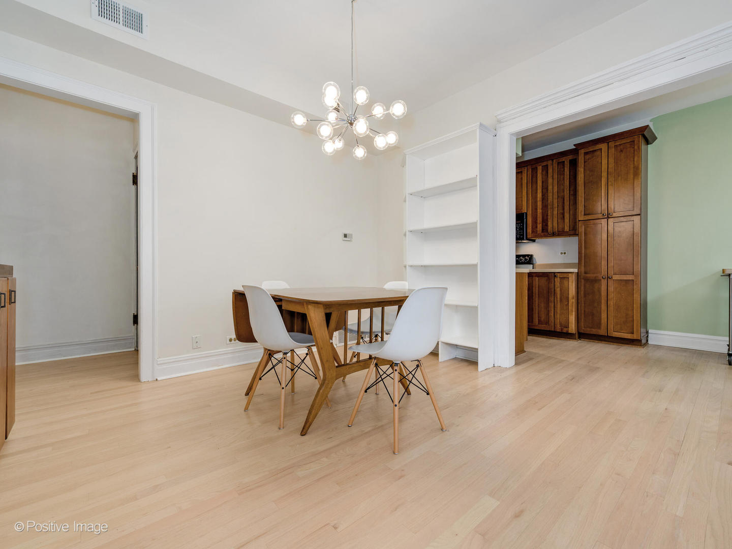 6259 North Sheridan Road, Unit 50 Chicago, IL 60660 - Photo 5 of 18 a view of a dining room with furniture and chandelier