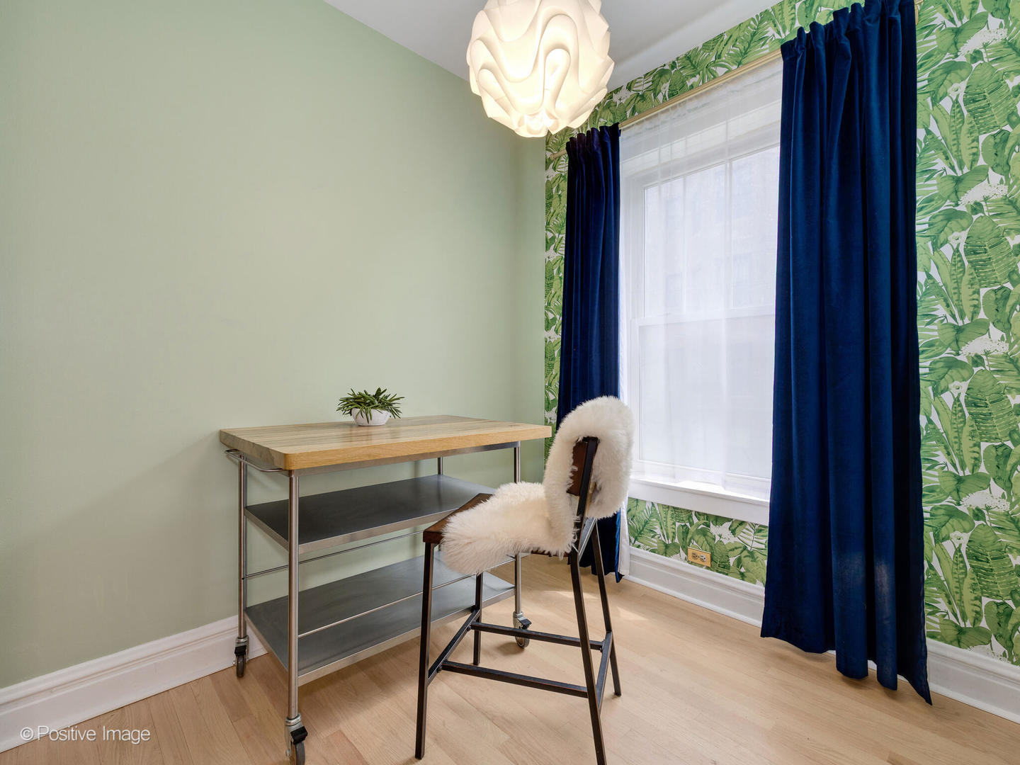 6259 North Sheridan Road, Unit 50 Chicago, IL 60660 - Photo 7 of 18 a view of a room that has a table and chair in it