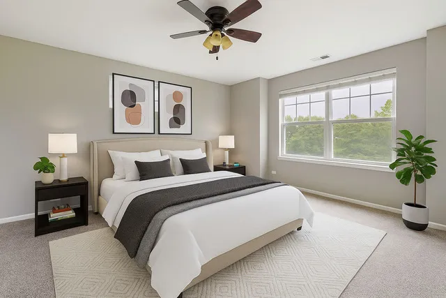 a spacious bedroom with a bed and a window