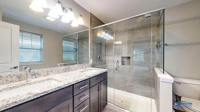 a bathroom with a granite countertop sink mirror and double
