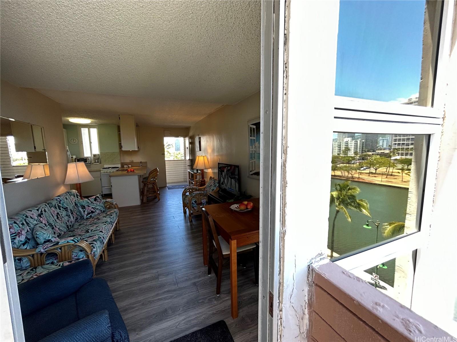 454 Nāmāhana Street, Unit 701 Honolulu, HI 96815 - Photo 16 of 25 a living room with furniture and a fireplace