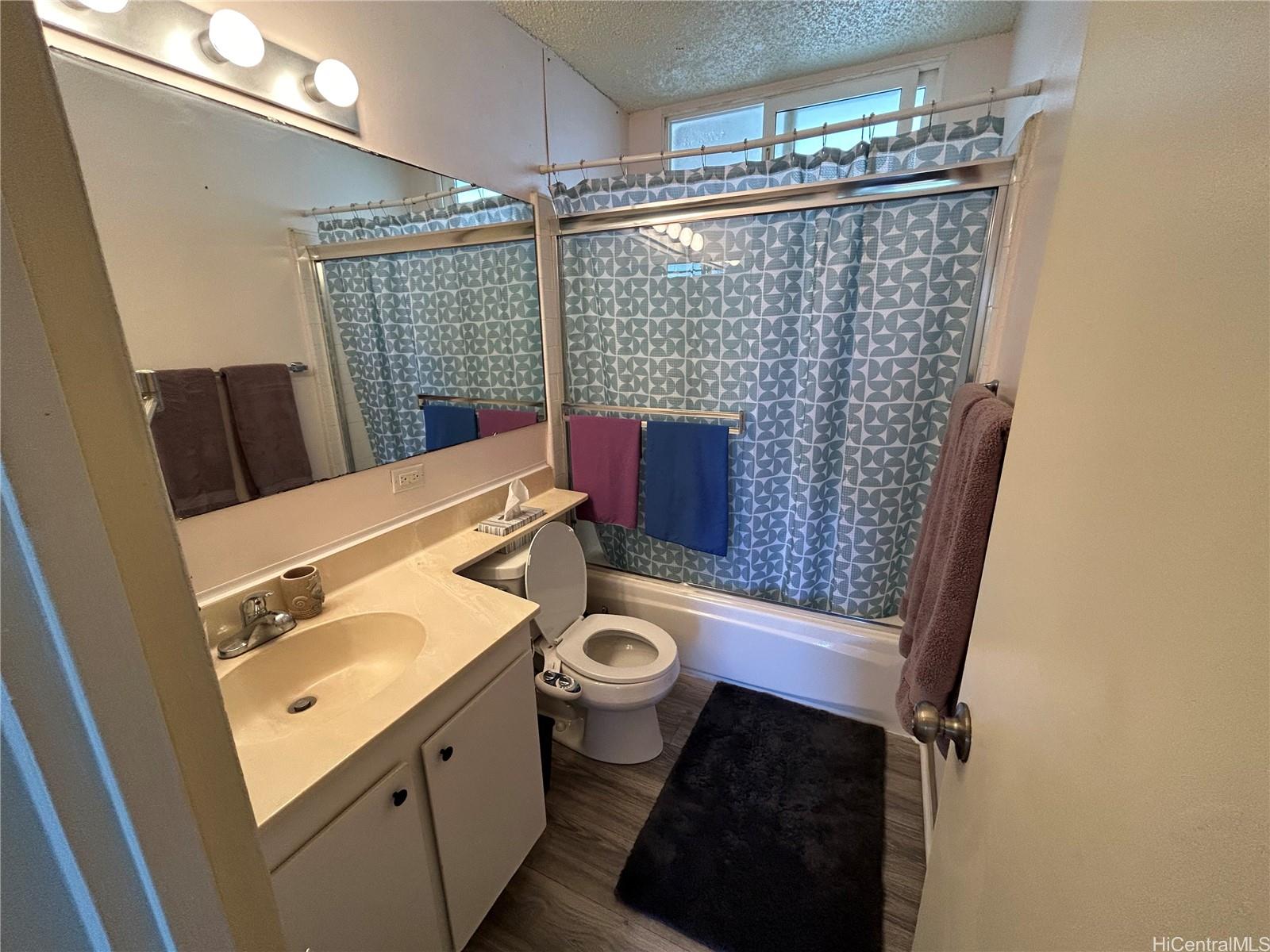 454 Nāmāhana Street, Unit 701 Honolulu, HI 96815 - Photo 19 of 25 a bathroom with a sink toilet and shower