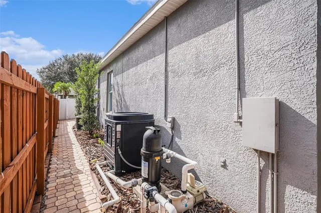 a backyard of a house with barbeque oven