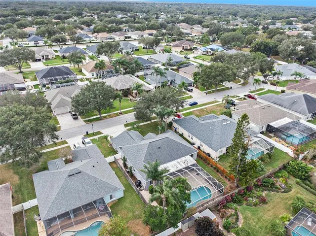 an aerial view of residential houses with outdoor space