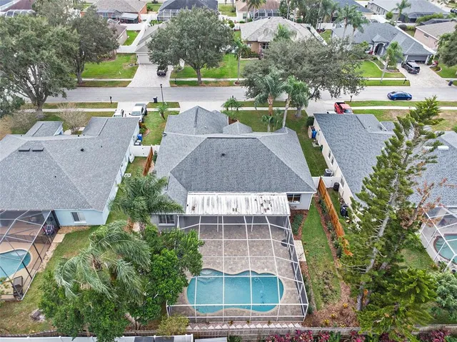 an aerial view of a house with a garden and plants