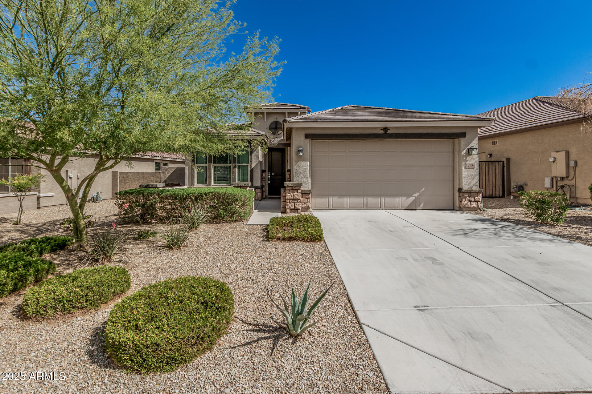 17784 West Sandy Road Goodyear, AZ 85338 - Photo 1 of 38 a front view of a house with a yard
