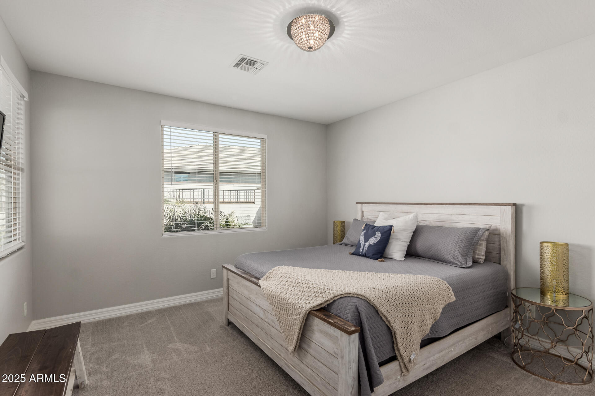 17784 West Sandy Road Goodyear, AZ 85338 - Photo 19 of 38 a bedroom with a bed and a window