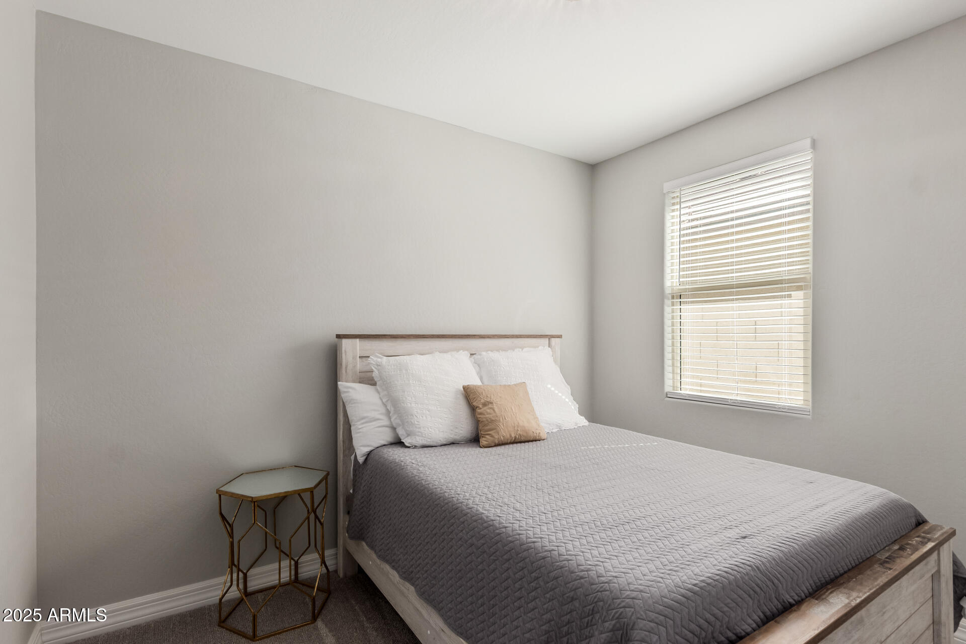 17784 West Sandy Road Goodyear, AZ 85338 - Photo 26 of 38 a bedroom with a bed and a window