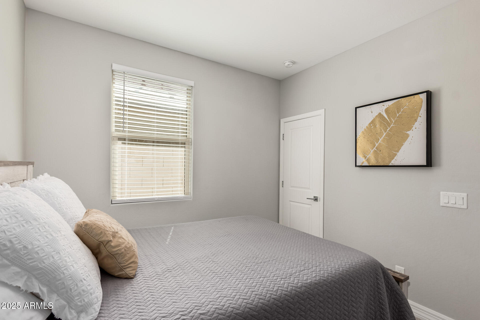 17784 West Sandy Road Goodyear, AZ 85338 - Photo 27 of 38 a bedroom with a bed and a window