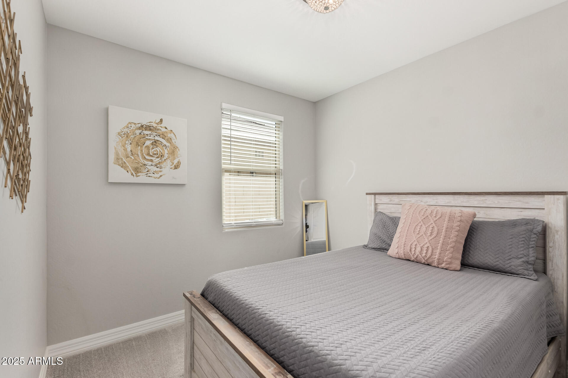 17784 West Sandy Road Goodyear, AZ 85338 - Photo 28 of 38 a bedroom with a bed and a window