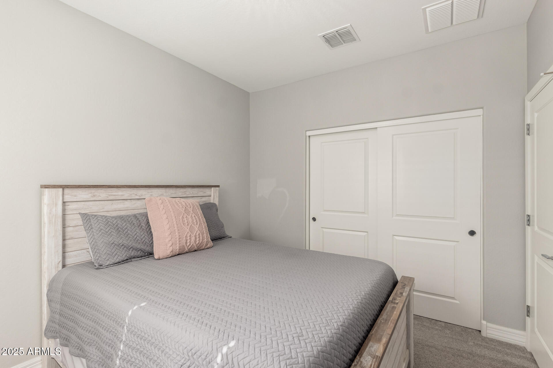17784 West Sandy Road Goodyear, AZ 85338 - Photo 29 of 38 a bedroom with a bed and a window