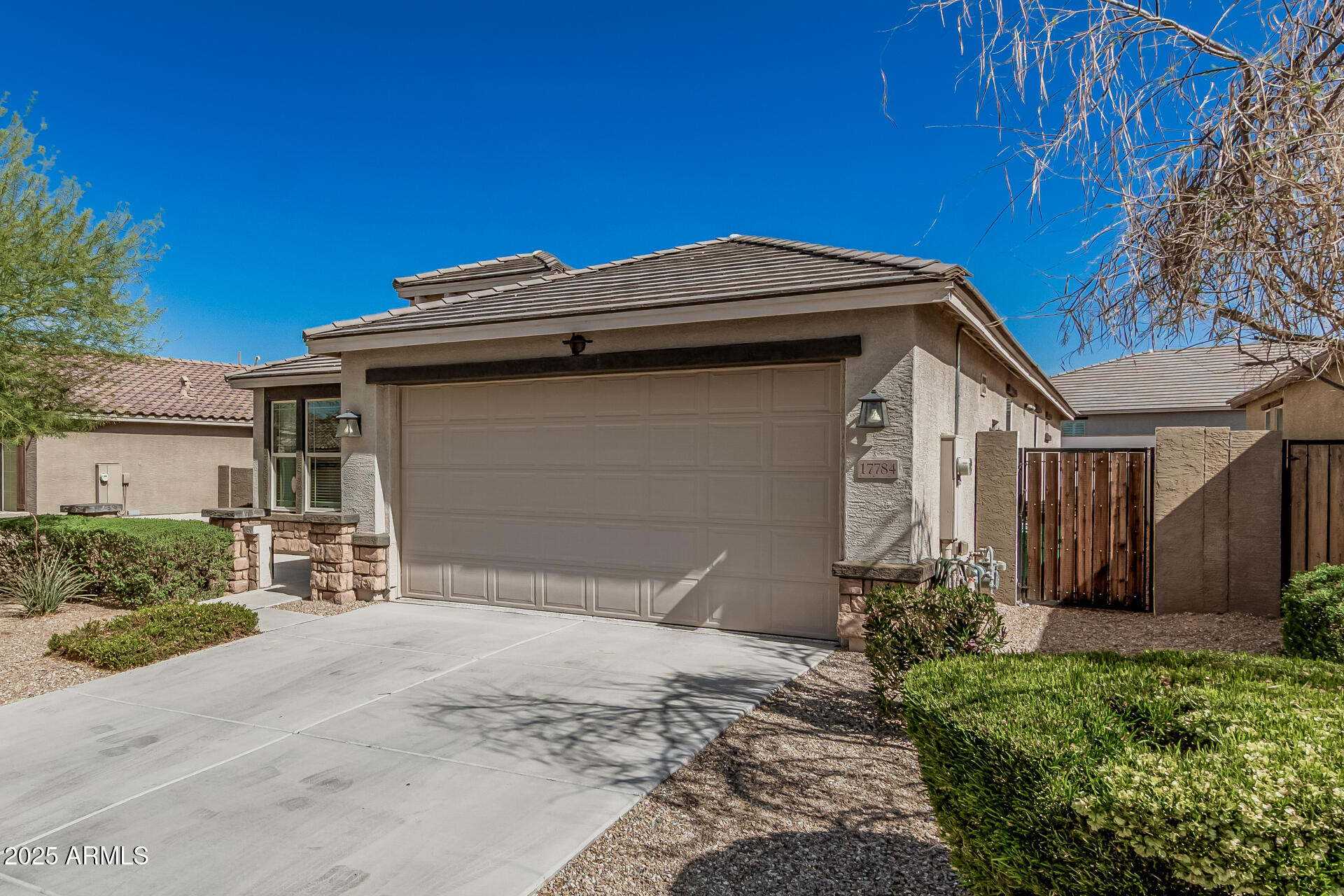 17784 West Sandy Road Goodyear, AZ 85338 - Photo 3 of 38 a front view of a house with a yard