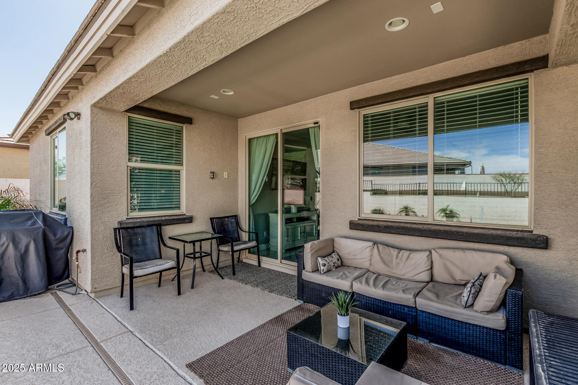 17784 West Sandy Road Goodyear, AZ 85338 - Photo 32 of 38 a balcony with furniture and a potted plant