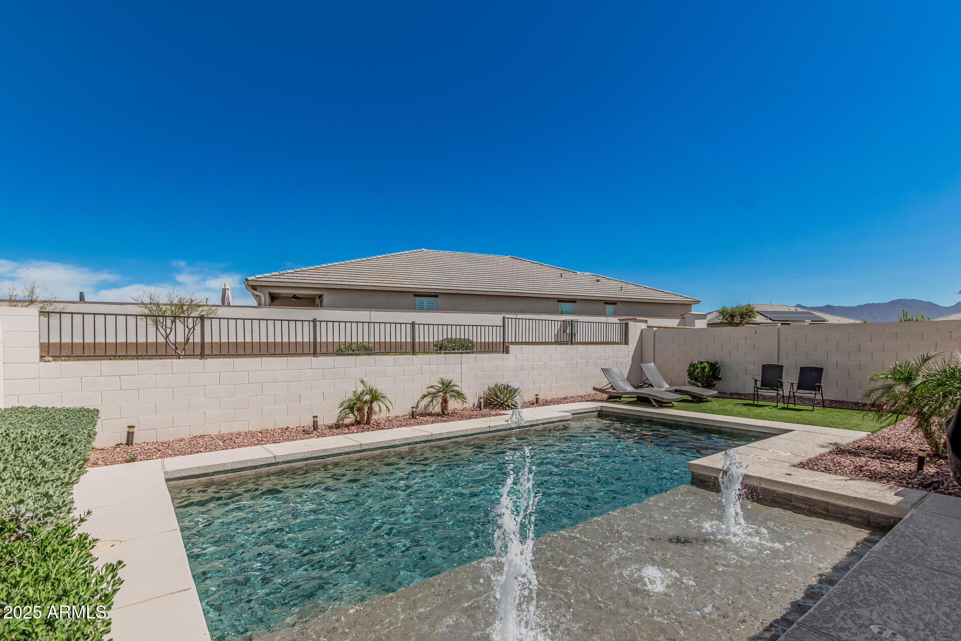 17784 West Sandy Road Goodyear, AZ 85338 - Photo 36 of 38 a front view of a house with a yard