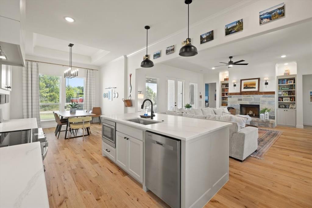 1028 Gatlin Circle Springtown, TX 76082 - Photo 12 of 30 a kitchen with sink stove and living room