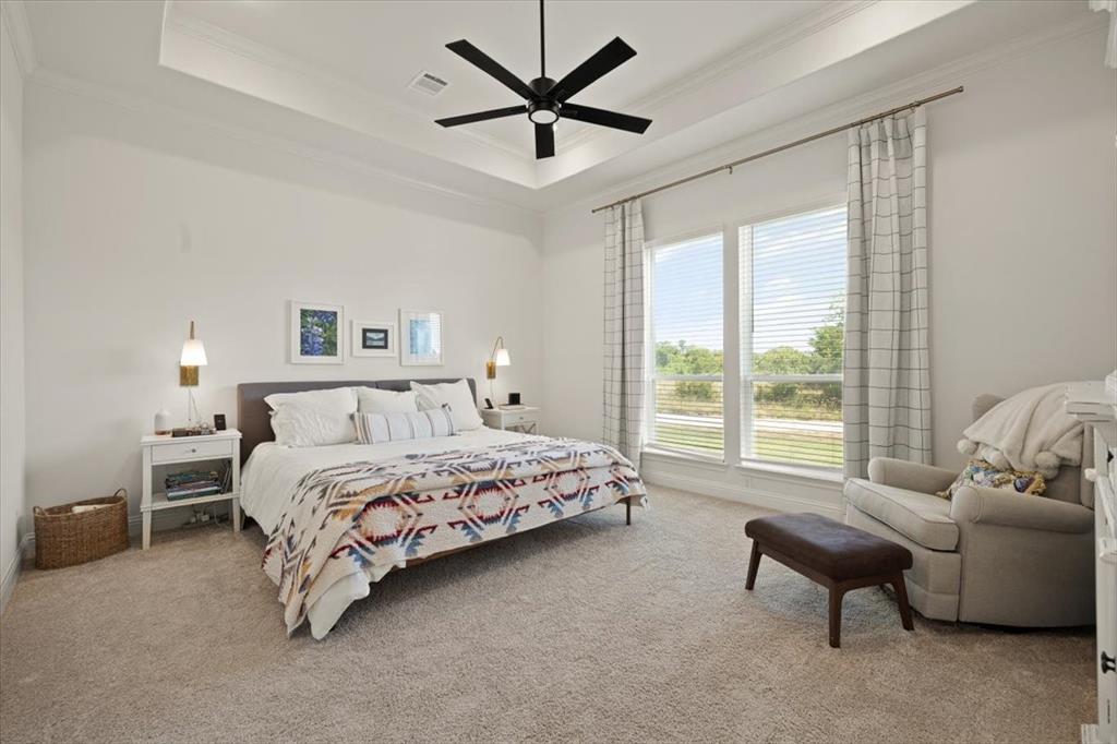 1028 Gatlin Circle Springtown, TX 76082 - Photo 15 of 30 a spacious bedroom with a bed and a couch