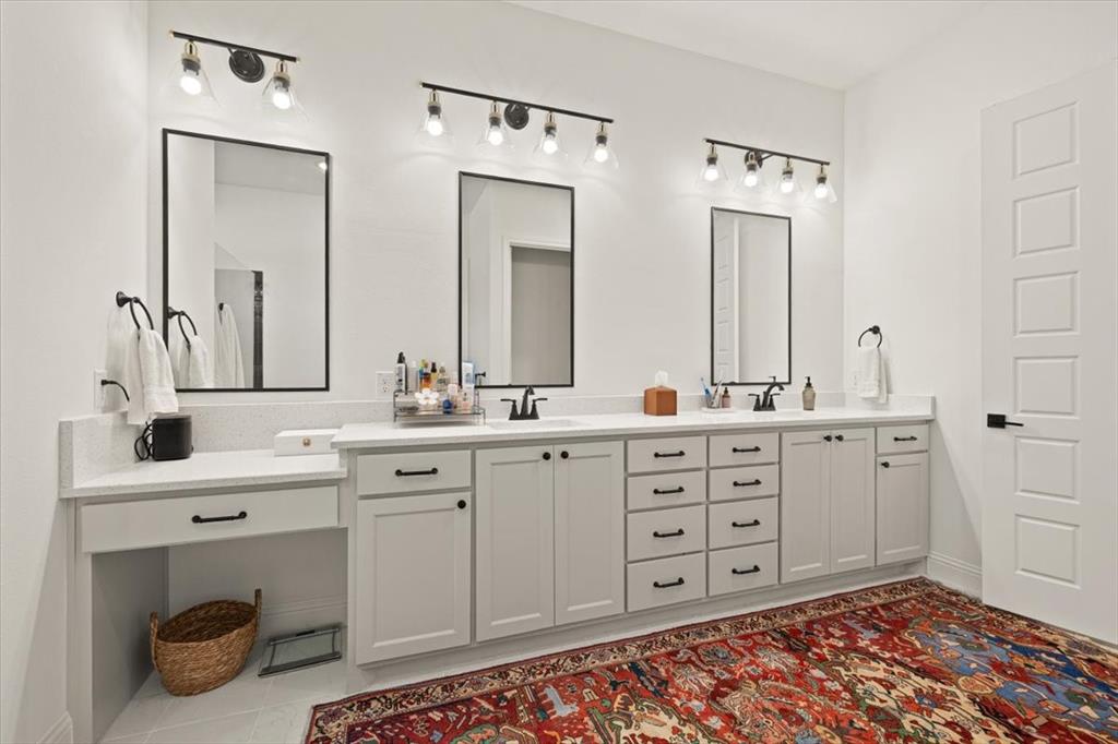 1028 Gatlin Circle Springtown, TX 76082 - Photo 19 of 30 a spacious bathroom with double sink and a mirror