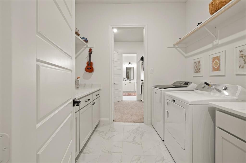 1028 Gatlin Circle Springtown, TX 76082 - Photo 20 of 30 a bathroom with a sink a mirror and a shower