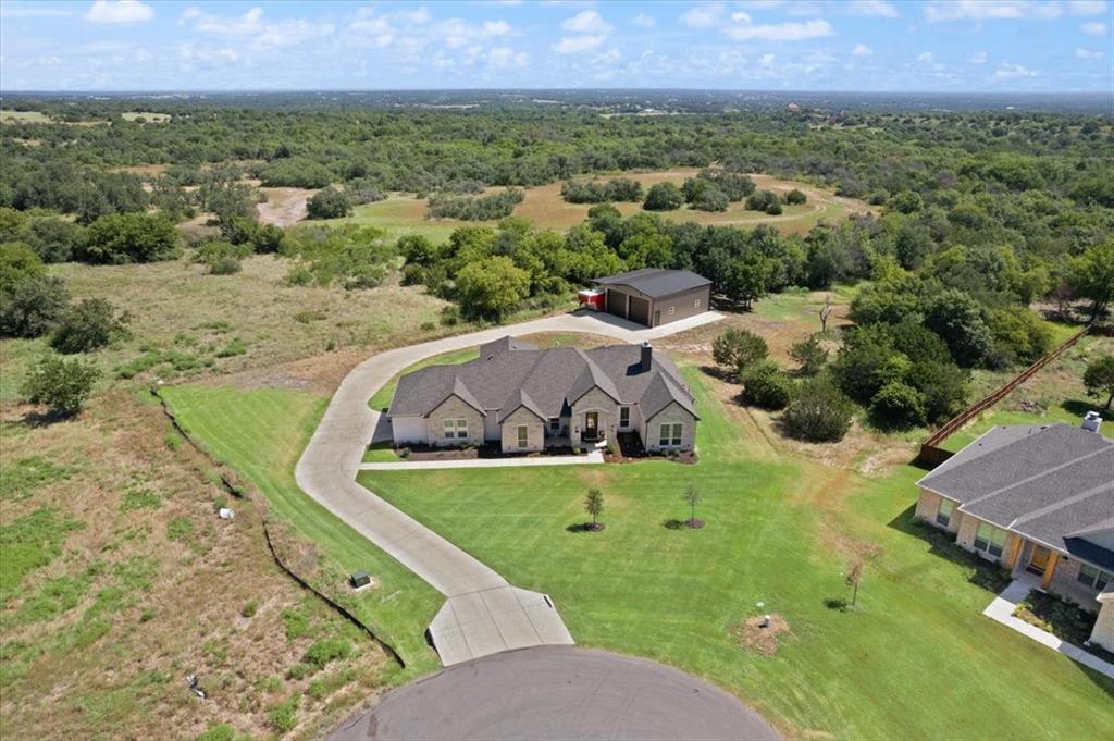 1028 Gatlin Circle Springtown, TX 76082 - Photo 2 of 30 an aerial view of a house with a yard