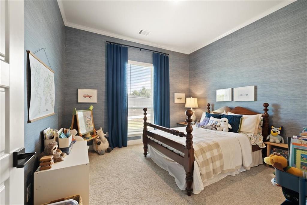 1028 Gatlin Circle Springtown, TX 76082 - Photo 22 of 30 a bedroom with bed and large windows