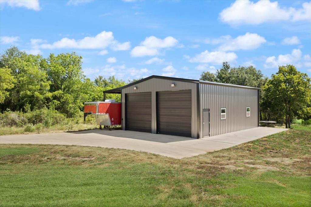 1028 Gatlin Circle Springtown, TX 76082 - Photo 26 of 30 a front view of a house with a yard