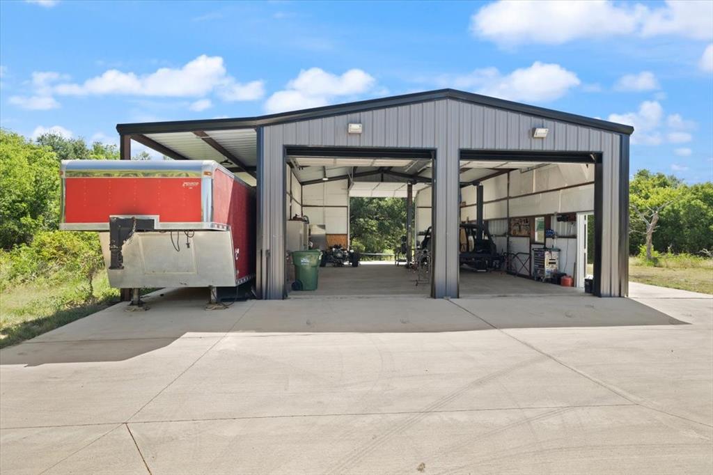 1028 Gatlin Circle Springtown, TX 76082 - Photo 28 of 30 a view of a chairs and fire pit in the patio