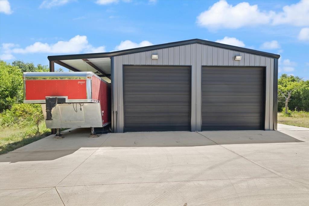 1028 Gatlin Circle Springtown, TX 76082 - Photo 29 of 30 a front view of a house with garage