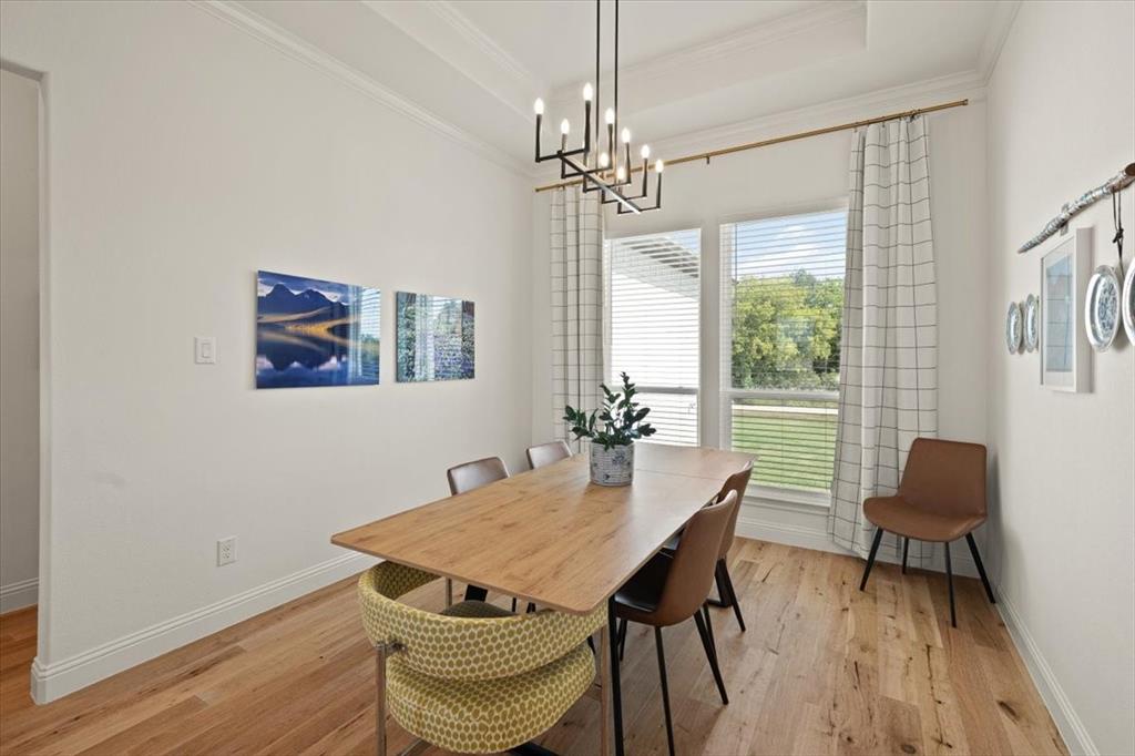 1028 Gatlin Circle Springtown, TX 76082 - Photo 9 of 30 a view of a dining room with furniture window and wooden floor