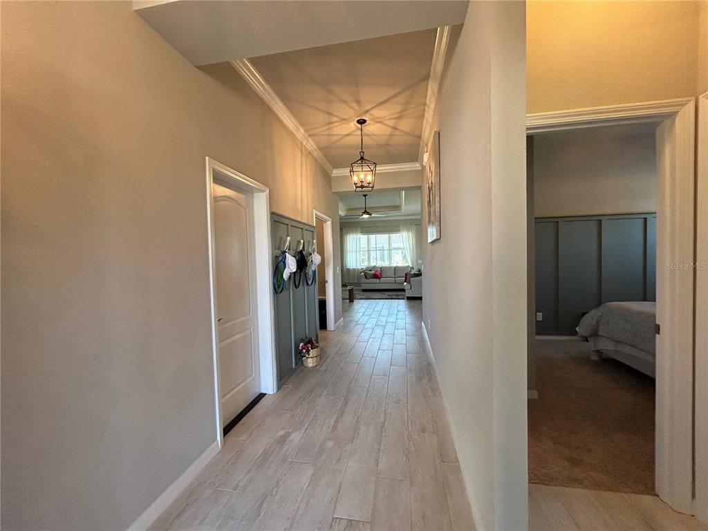 12101 Southwest 29 Place Gainesville, FL 32608 - Photo 12 of 26 a view of hallway with wooden floor