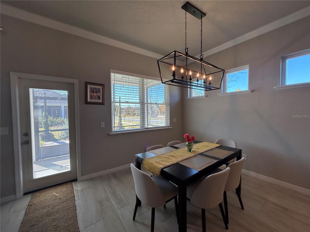12101 Southwest 29 Place Gainesville, FL 32608 - Photo 6 of 26 a dining room with a table and chairs