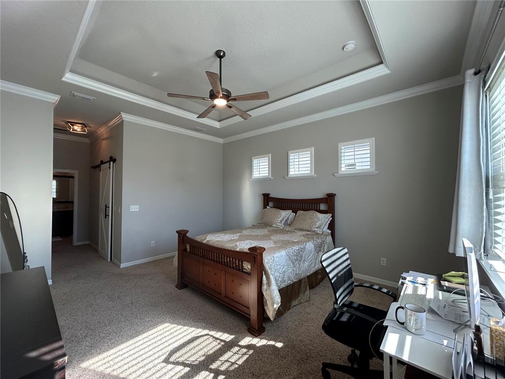 12101 Southwest 29 Place Gainesville, FL 32608 - Photo 8 of 26 a bedroom with bed and window