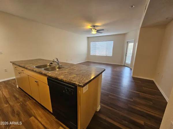 a kitchen with a sink and cabinets