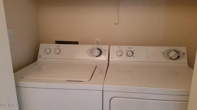 a close up view of washer and dryer with washer and dryer
