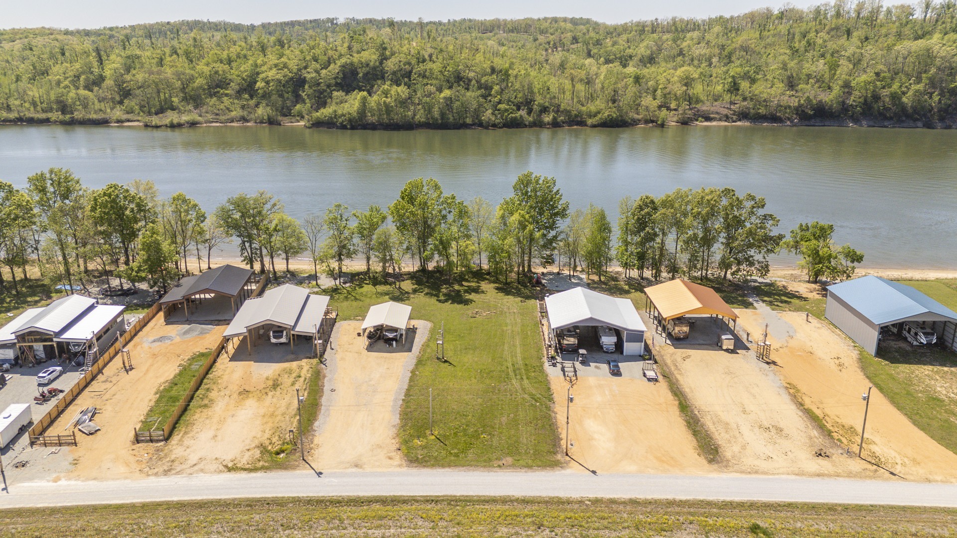 855 Hardin Bottom River Road Clifton, TN 38425 - Photo 18 of 30 an aerial view of residential houses with outdoor space and lake view
